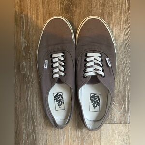 Woman’s grey vans